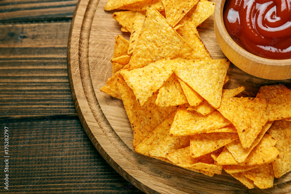 Mexican Nachos Chips with Barbecue Sauce. Concept - bad food, cafe, pub, party. Flat lay. Mexican Nachos Chips with Barbecue Sauce. Concept - bad food, cafe, pub, party. Flat lay.