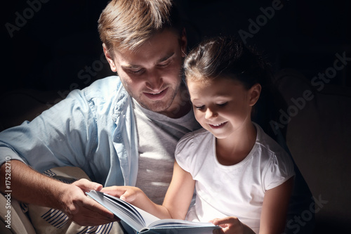 Young man and his little da...