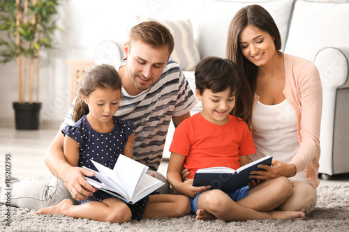 Happy family reading books ...