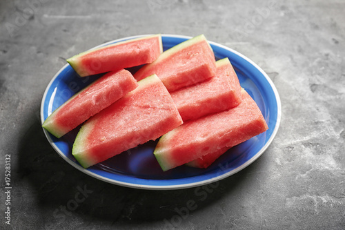 Plate with watermelon slices on kitchen table