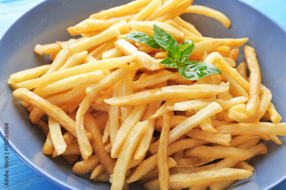 Plate with yummy french fries, closeup Plate with yummy french fries, closeup