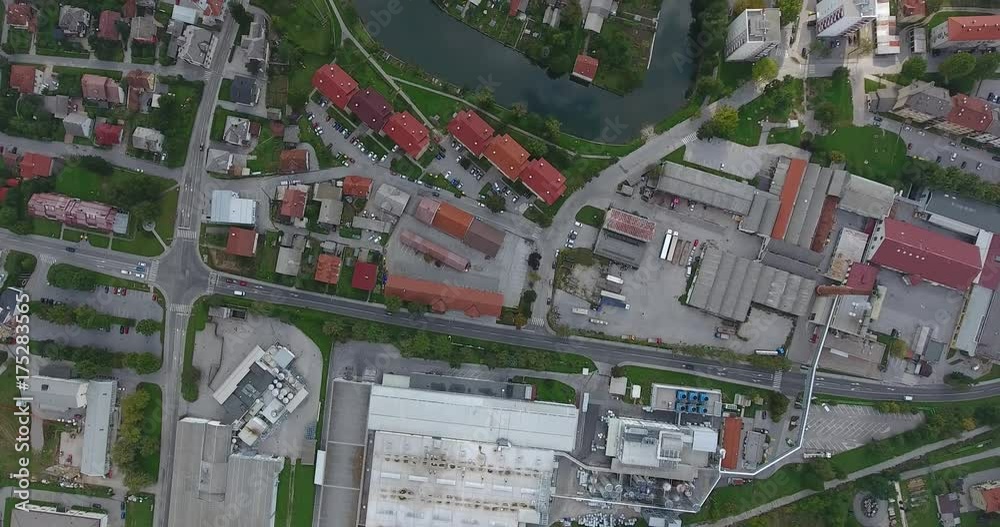 Top view of a small town with river flowing through. Top view of a small town with river flowing through.