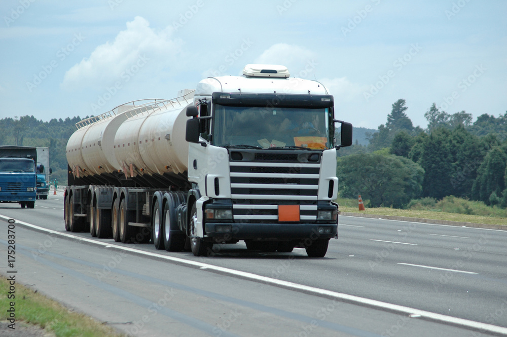 white double tanker going downhill