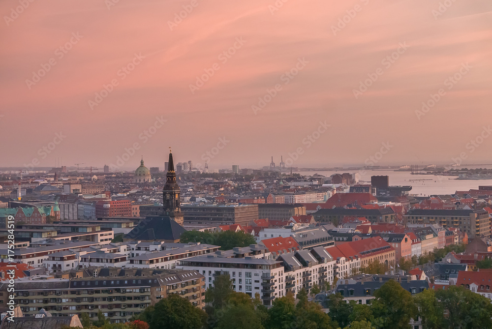 Copenhagen skyline with industrial harbor area at sunrise