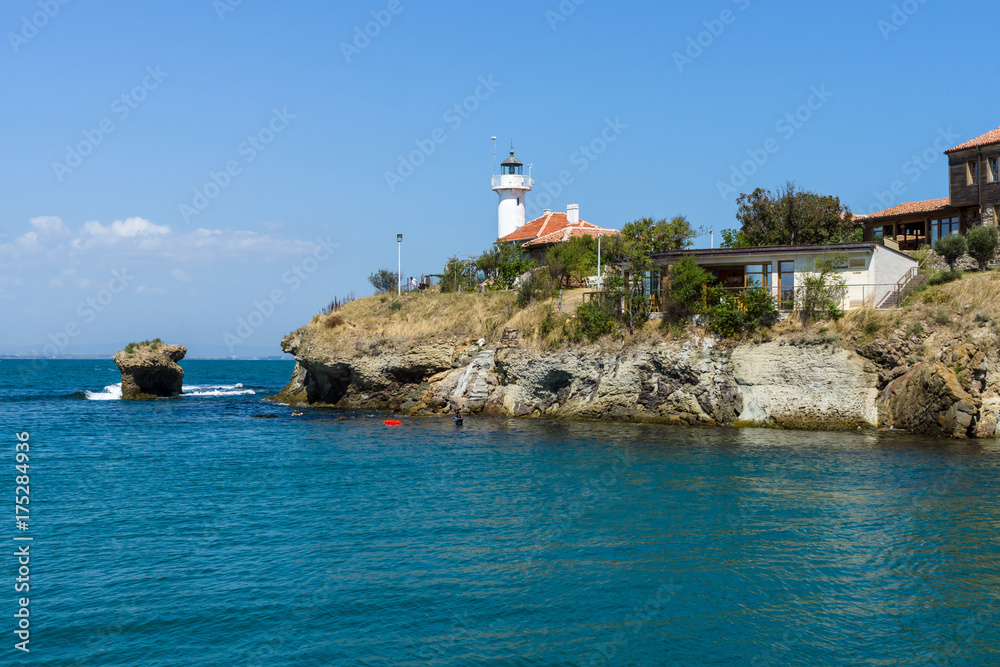 The island of St. Anastasia. In the background there are rocks and a lighthouse. Summer sea landscape. Burgas Bay. Black Sea. Bulgaria.