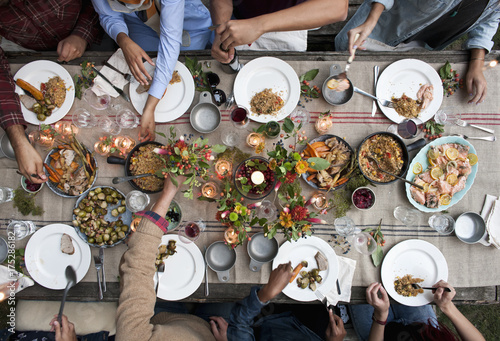 Overhead of People at Dinner Party