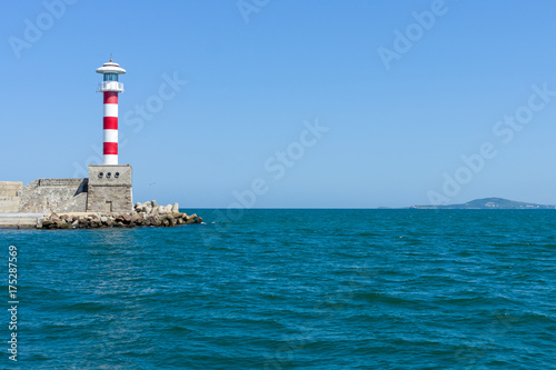 Lighthouse at the entrance to the water area of the sea port of Burgas. Bulgaria.