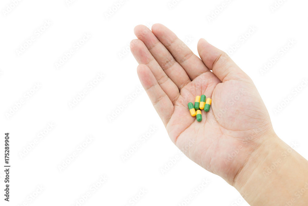 A hand of a man with some capsule pills on white background, clipping part A hand of a man with some capsule pills on white background, clipping part