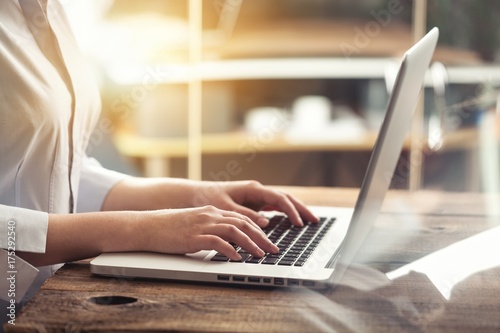 Woman typing computer.