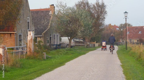 Wallpaper Mural elder women friends on a mobility scooter and a bicycle Torontodigital.ca