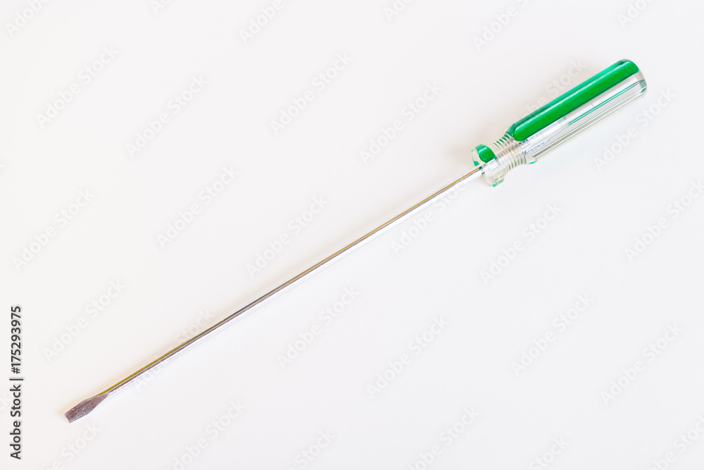 Screwdriver with a long rod. Transparent green handle screwdriver with flat tip Screwdriver with a long rod. Transparent green handle screwdriver with flat tip