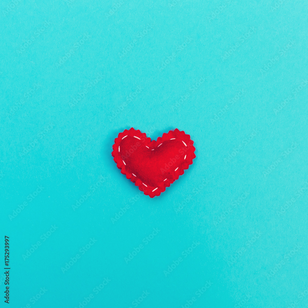 Handmade heart cushions on a blue background Handmade heart cushions on a blue background
