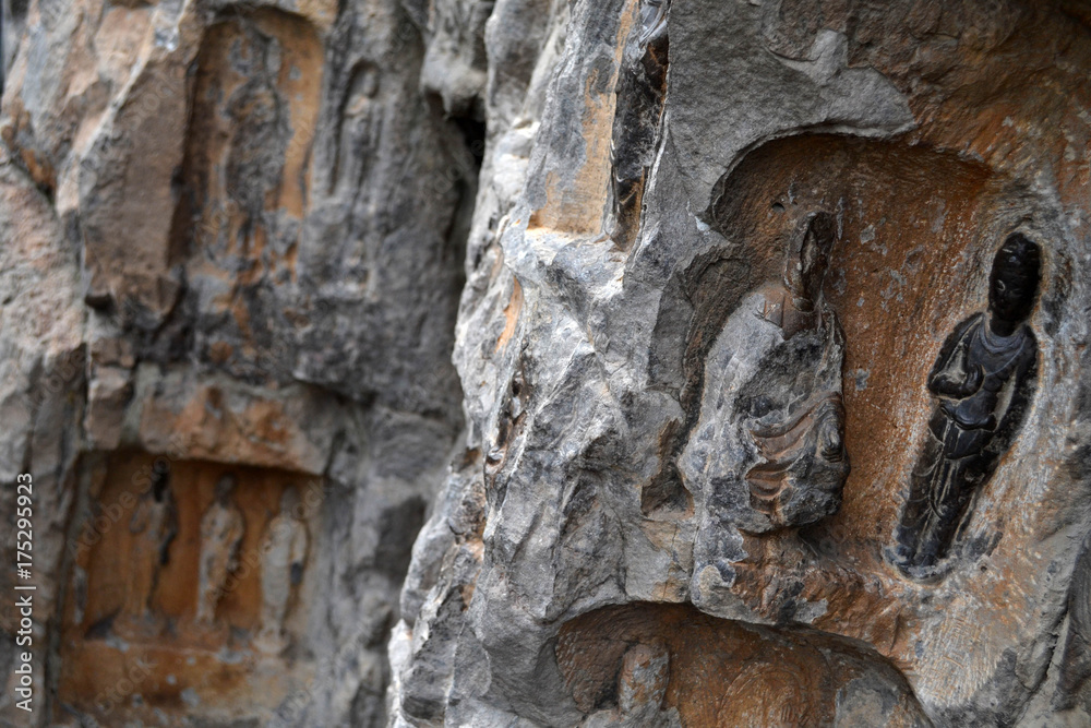 The holes (with Buddha statue inside) -which is more than thousands- around Longmen Grottoes on the hill. Pic was taken in September 2017 The holes (with Buddha statue inside) -which is more than thousands- around Longmen Grottoes on the hill. Pic was taken in September 2017