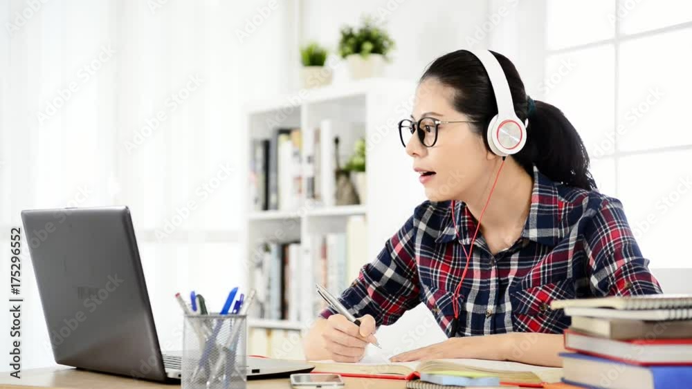 student learning on line with headphones