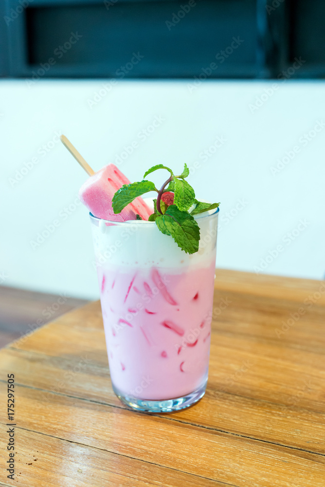 strawberry popsicle with pink milk in glass strawberry popsicle with pink milk in glass
