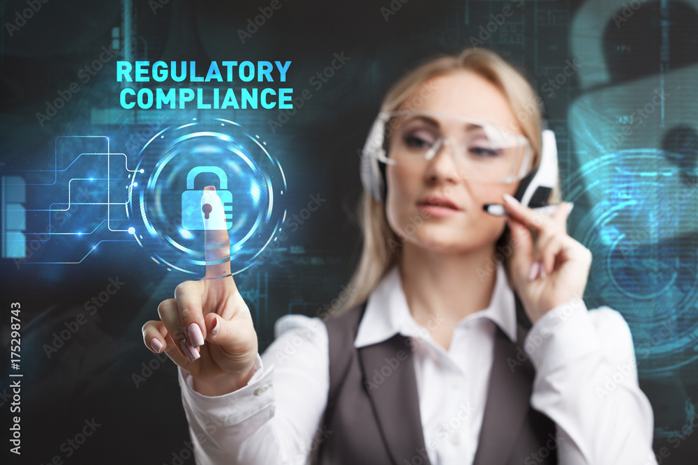 Young businesswoman working in virtual glasses, select the icon REGULATORY COMPLIANCE on the virtual display. Young businesswoman working in virtual glasses, select the icon REGULATORY COMPLIANCE on the virtual display.