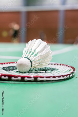 badminton shuttlecock and racket on court © ttanothai