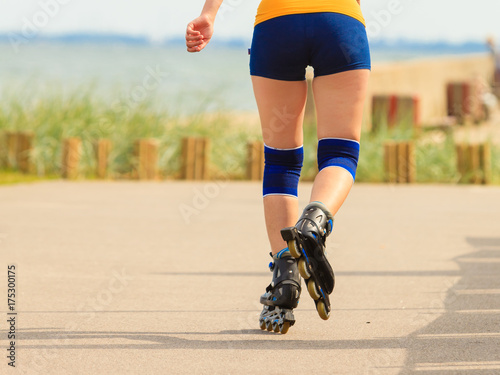 Young woman rollerblading outdoor on sunny day