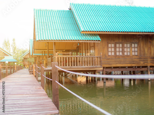 Wooden way with home stay on lake