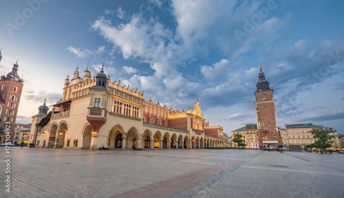 Cloth Hall and Town Hall tower on the Main Market Square in Krakow, illuminated in the morning photo