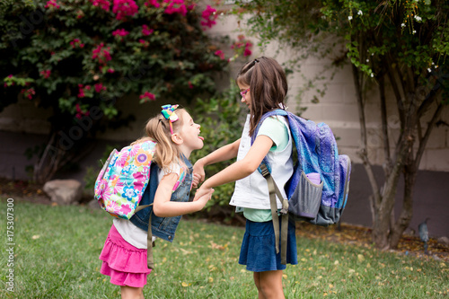 Two girls are playing excitedly and anxiously before their first day of school.  © falonkoontz