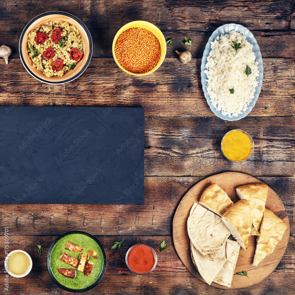 Assorted indian food on a wooden background. Assorted indian food on a wooden background.