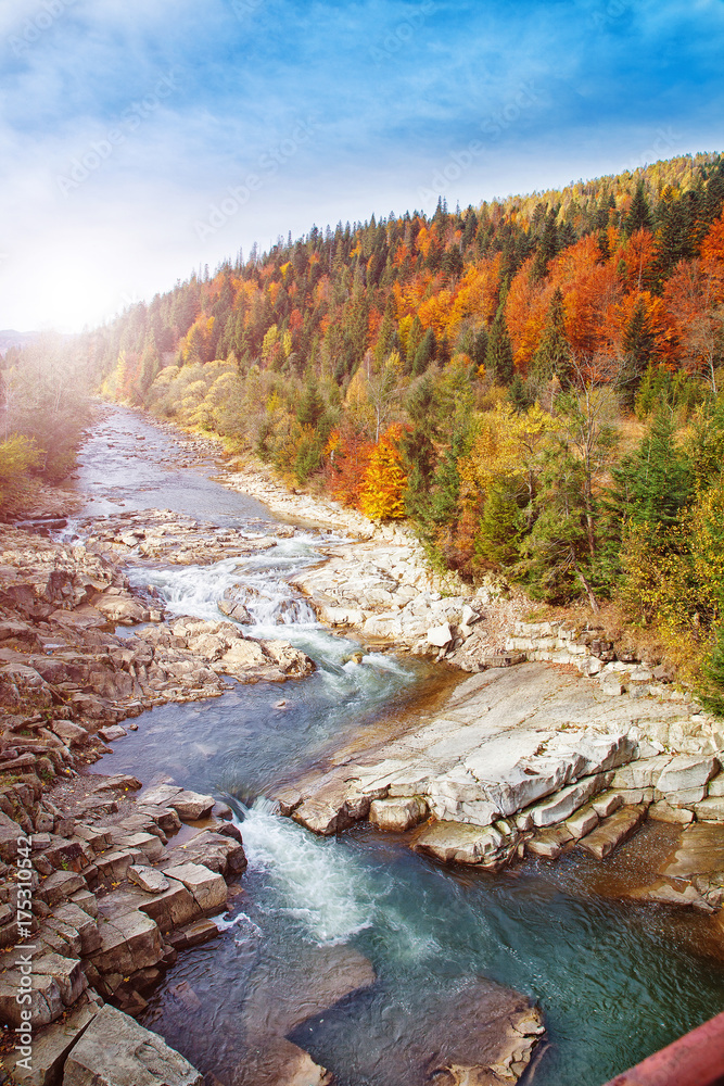 Late Autumn Landscape. Sormy mountain river with stones in the mountains Late Autumn Landscape. Sormy mountain river with stones in the mountains