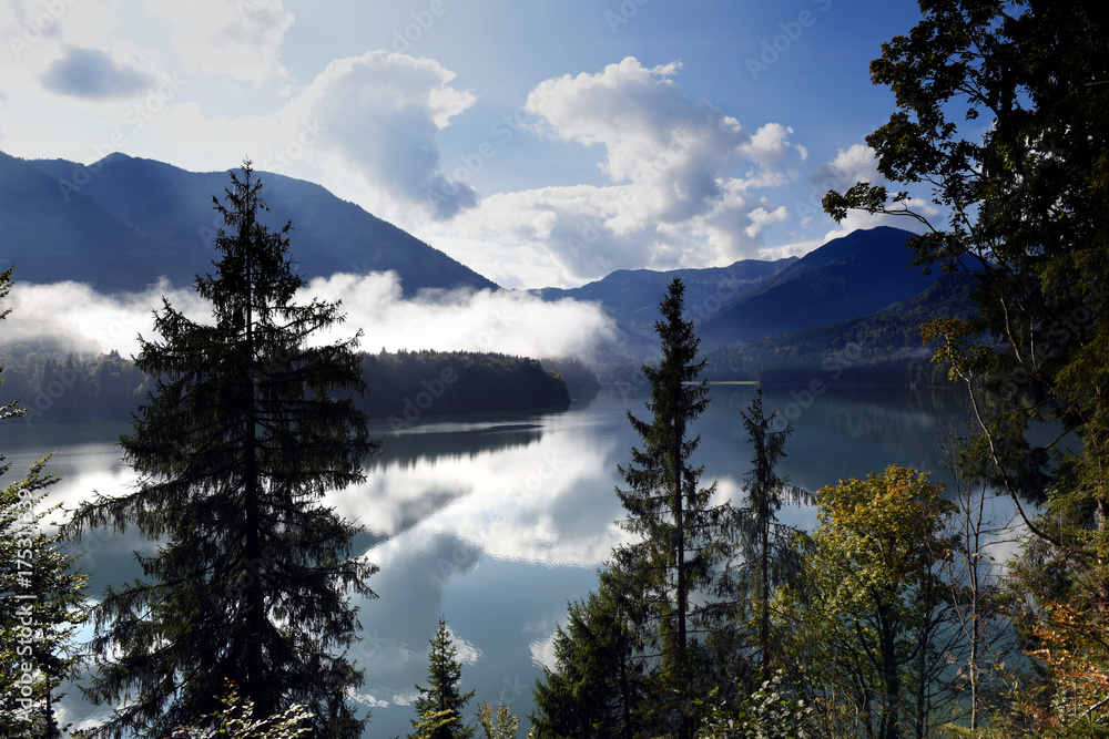 panoramic landscape view to natural mountain lake Sylvenstein lake in Bavaria, Germany with fog in the mountains