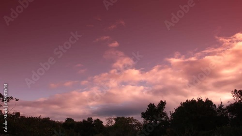 orange clouds moving  in apocalyptic sky filmed in timelapse
