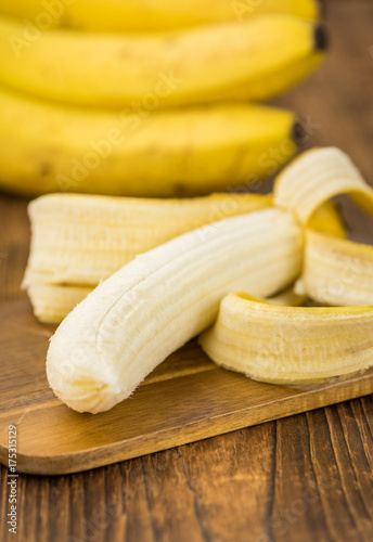 Wooden table with Whole Bananas, selective focus