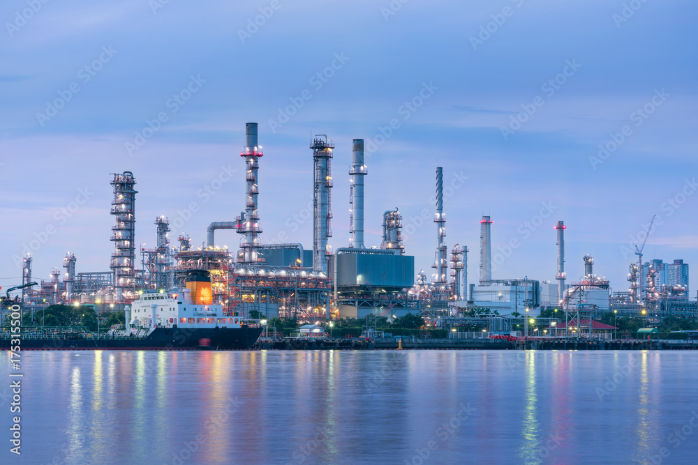 Oil and Gas plant with shipping loading dock at twilight