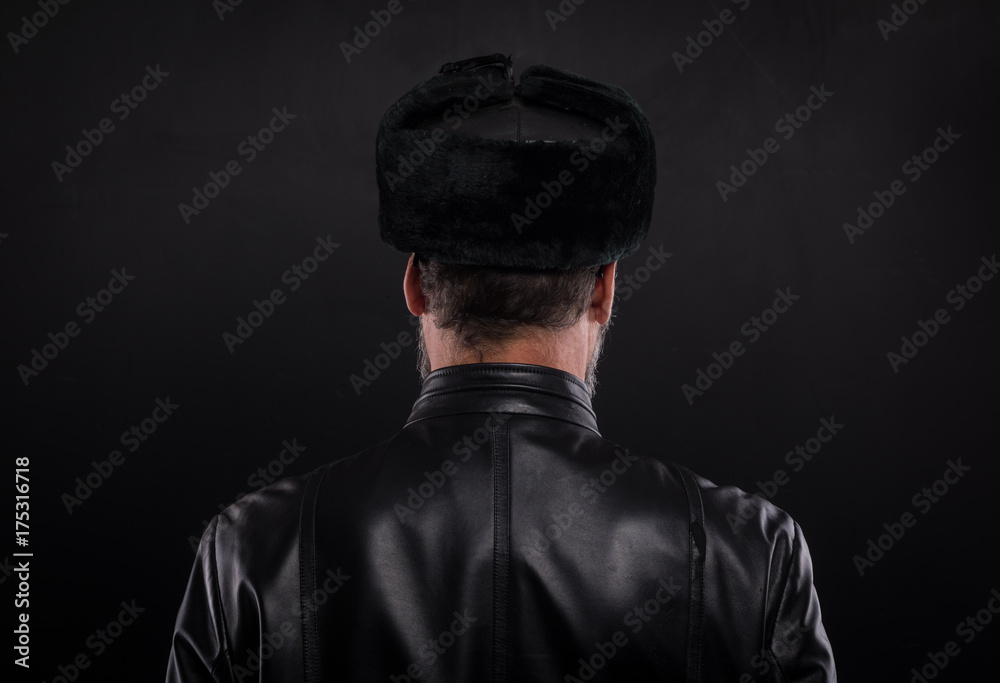 studio portrait of a man in a black winter hat studio portrait of a man in a black winter hat
