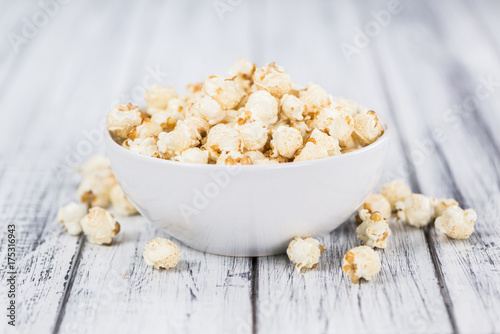 Popcorn on wooden background; selective focus