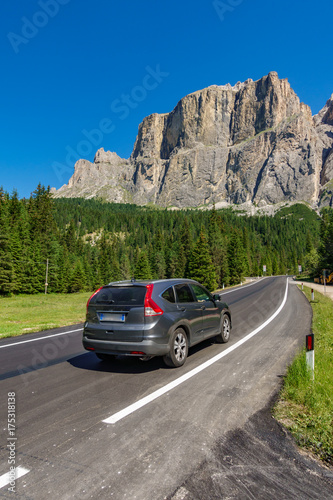 Mountain road with blurred car in Dolomites © F.C.G.
