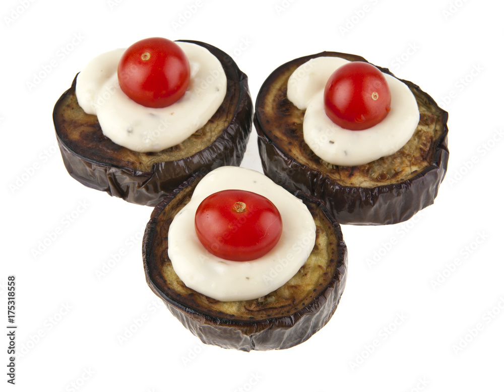 fried eggplant with sauce and a red tomato isolated on white background closeup fried eggplant with sauce and a red tomato isolated on white background closeup