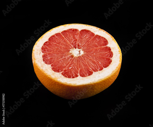 Grapefruit on a black background closeup
