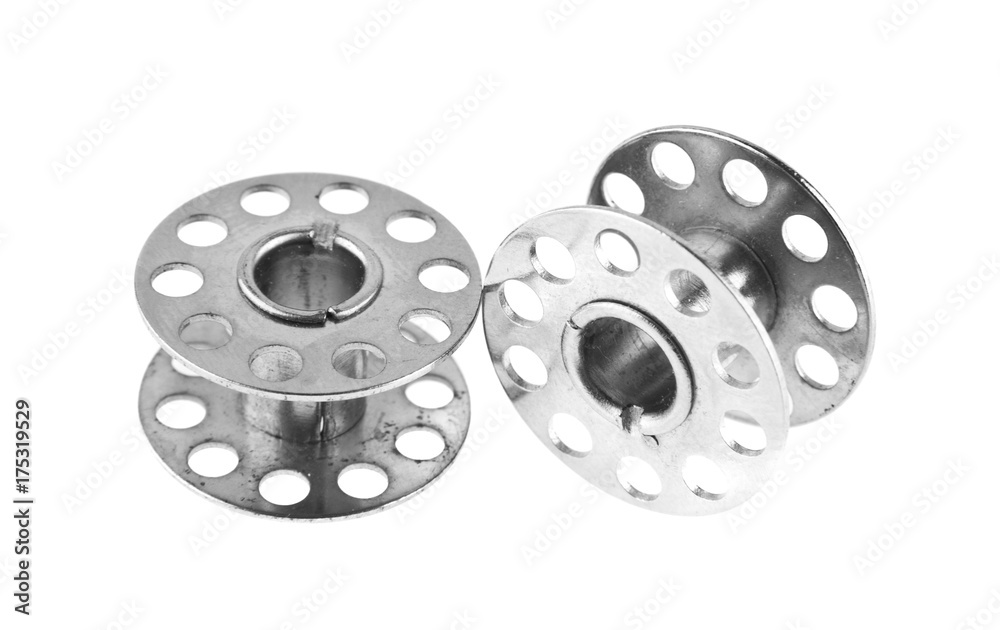 metal reel for threads isolated on white background close-up metal reel for threads isolated on white background close-up