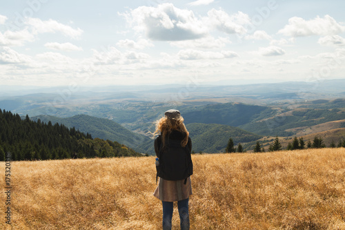 Hiker woman enjoying the view in nature. © Kitja