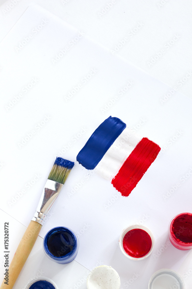 France. French flag painted on white paper with brushes France. French flag painted on white paper with brushes