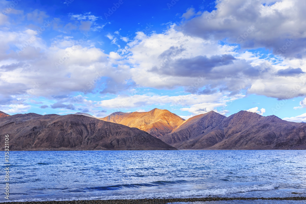 Pangong tso (Lake). It is huge lake in Ladakh, altitude 4,350 m (14,270 ft). It is 134 km (83 mi) long and extends from India to Tibet. Leh, Ladakh, Jammu and Kashmir, India.
