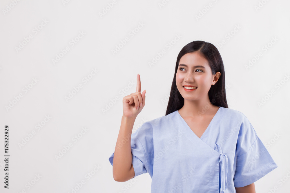 woman patient pointing finger up to blank space woman patient pointing finger up to blank space