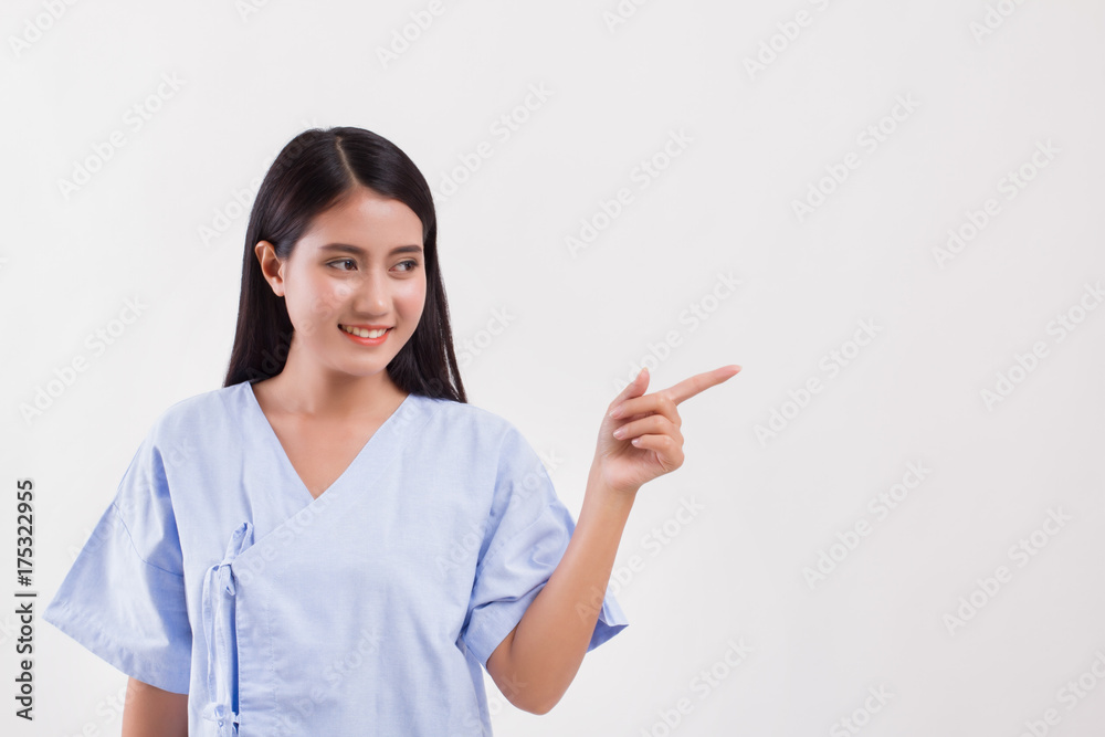 woman patient pointing finger up to blank space woman patient pointing finger up to blank space