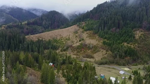 top view of the mountains, houses and fog. dron view. photo