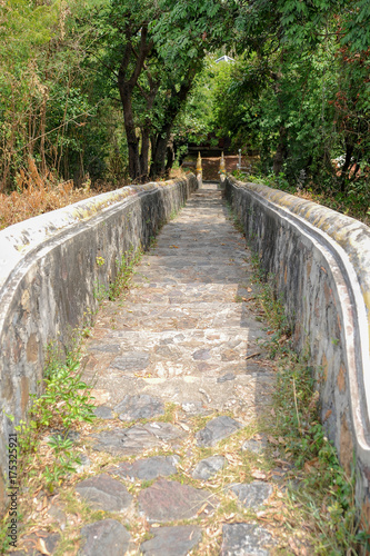 Old stone stairs to the forest