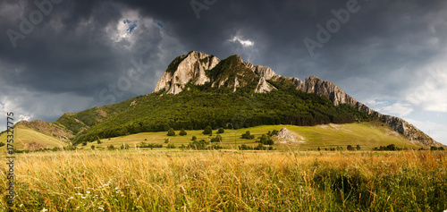 Panorama of Piatra Secuiului over Rimetea village in the Transcaului Mountains in western Transylvania, 25 km west of Turda, Romania photo