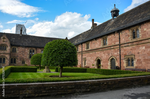 A nice square with trees and hedges next to Chetham's library in Manchester