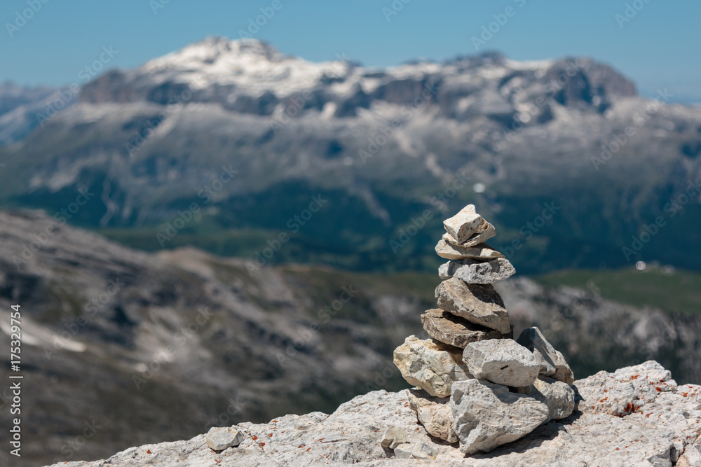 Stones Piled on Each Other and Mountain Ridge in Italian Dolomites Alps in Summer Time in Background Stones Piled on Each Other and Mountain Ridge in Italian Dolomites Alps in Summer Time in Background