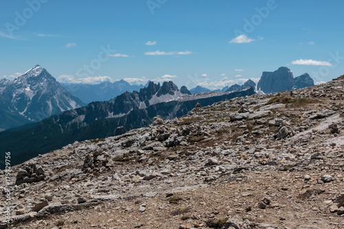 Mountain Ridge with Big Stone among Barren Mountains in Italian Dolomites Alps in Summer Time