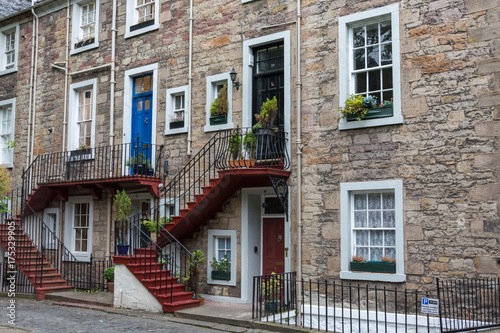 Nice colourful stairs to a front door at a stone house in Edinburgh