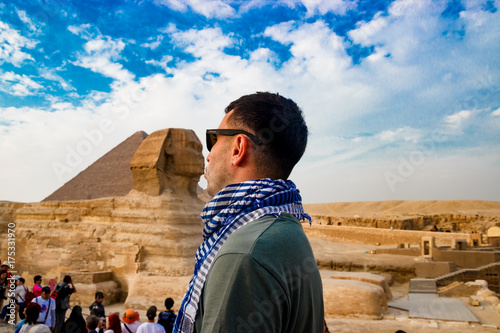 Looking at sphinx in Giza. Cairo, Egypt